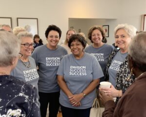 A group of women gathered at a mastermind meeting.